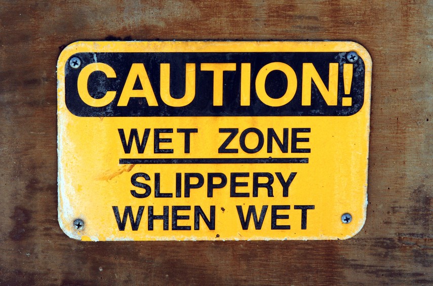 slippery when wet sign. signs: “Slippery When Wet”