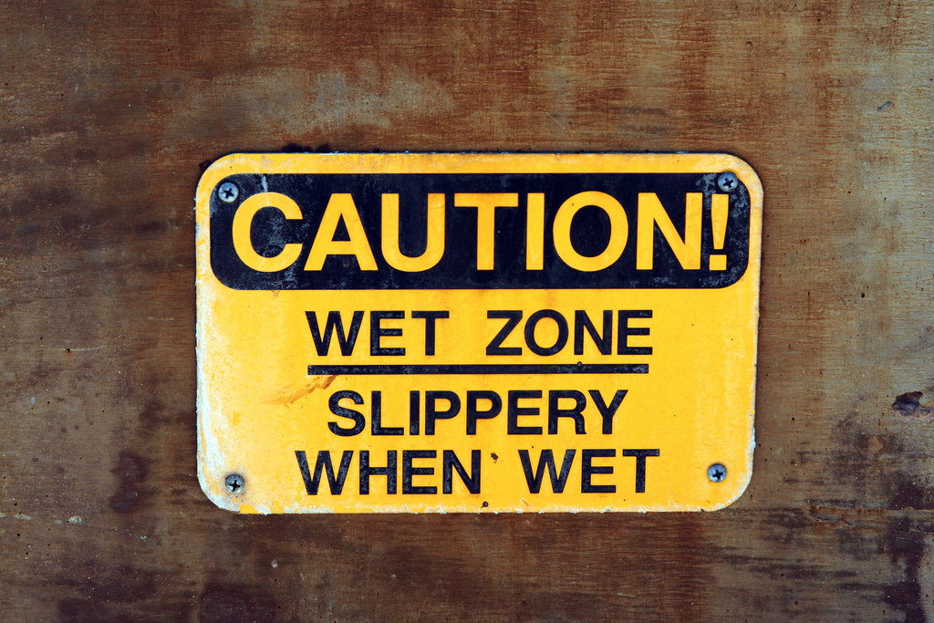 slippery when wet sign. signs: “Slippery When Wet”