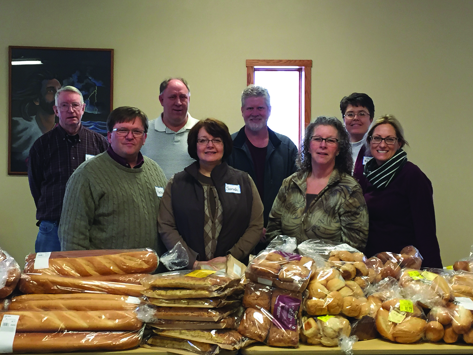 Church member and community volunteers assisting with the mobile pantry are: (front row l-r) Kent Dunwoody, Sarah Dunwoody, Marcia Hemmers, Erin Pingel, (back row) Richard Schwarz, Jeff Johnson, Mark White and Sue Ahlers. Photo courtesy Erin Pingel.