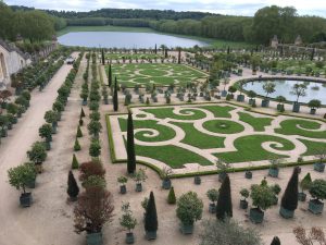 The magnificent gardens at the Palace of Versailles, viewed from the terrace above them.