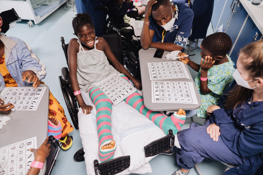 Photo of orthopedic patients playing bingo aboard the Mercy Ship.