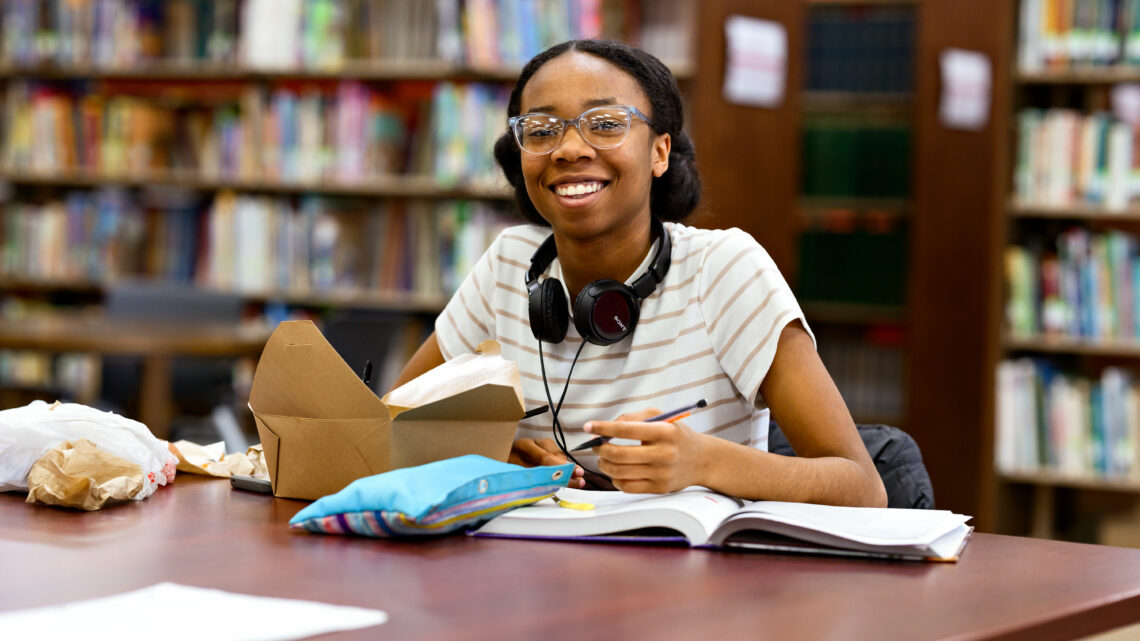 Photo of Lanai Sanford studying in the library.